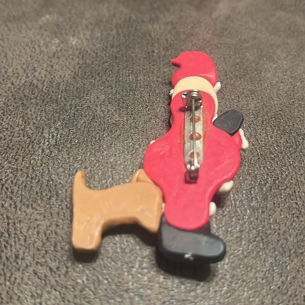 Vintage santa with dog biting brooch